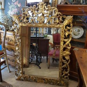 Italy 18th Century Mirror In Gilded Wood.