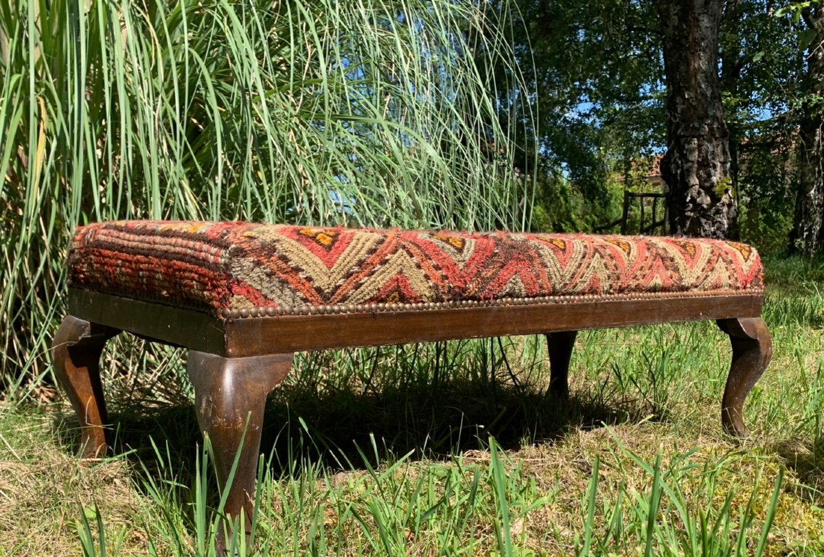 English Bench Covered With An Oriental Rug -photo-1