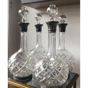 The Suite Of 4 Crystal And Silver Carafes 