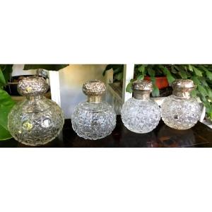 The Suite Of 4 English Crystal And Silver Bottles