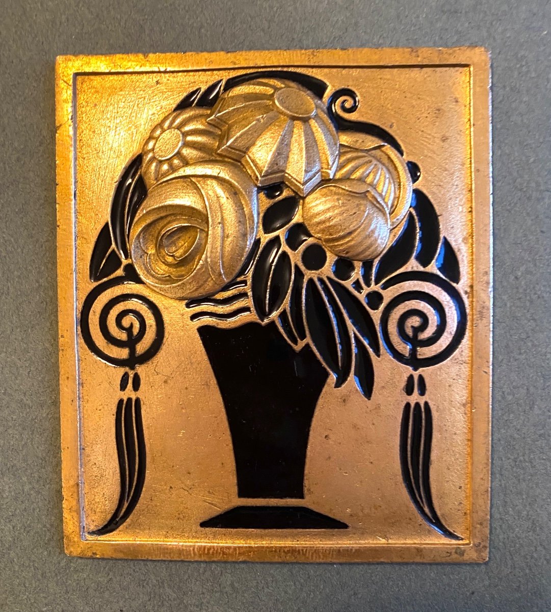 Art Deco Ornamental Plaque In Bronze And Black Enamel. Stylized Flower Vase. 1920s. 