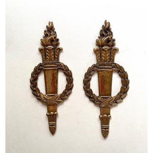 Pair Of 19th Century Ornamental Bronzes In Neoclassical Style. Torches And Laurel Wreaths.