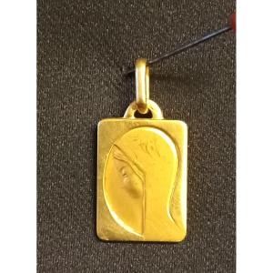 Pendentif à l'image de la vierge. Or 18kt jaune. Epoque 1970