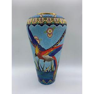 Vase en émaux de Longwy à décor de perroquet et de visage égyptien