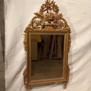 Miroir d'époque Louis XVI, bois doré. 