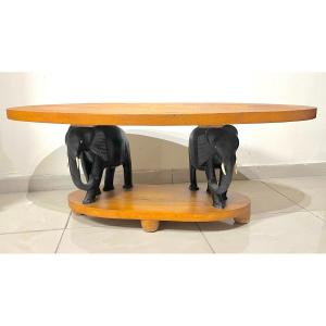 Coffee Table Resting On Two Wooden Elephants 