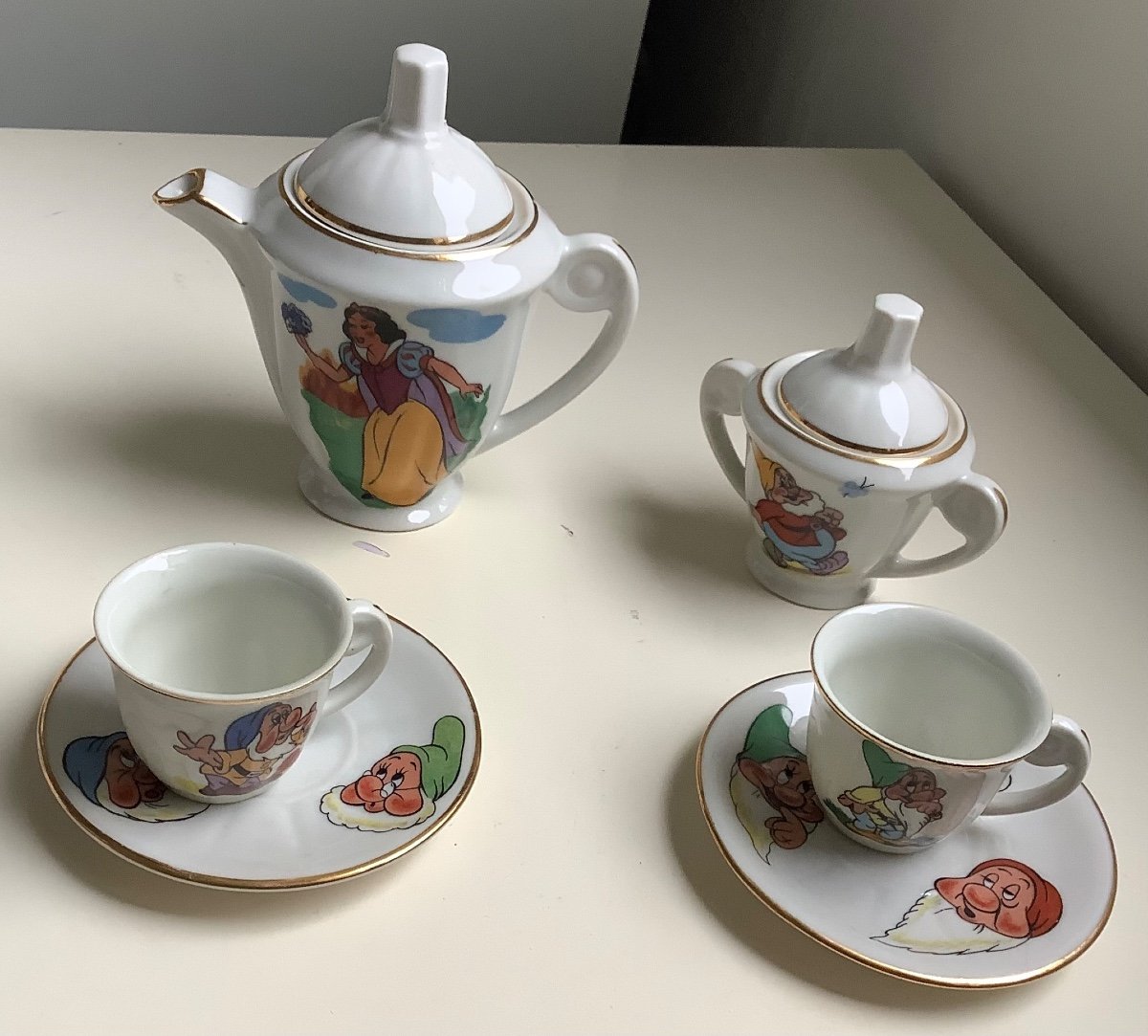 A Porcelain Dinner Set Decorated With Snow White And 7 Dwarfs 