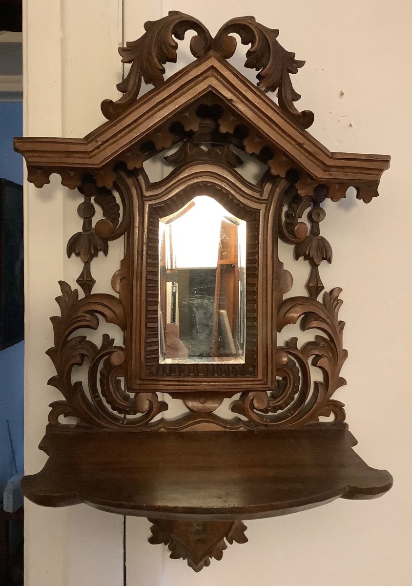 A Wooden Shelf With Beveled Glass