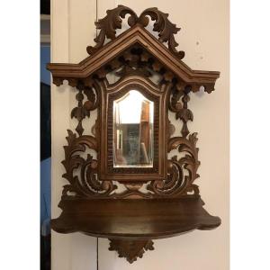 A Wooden Shelf With Beveled Glass