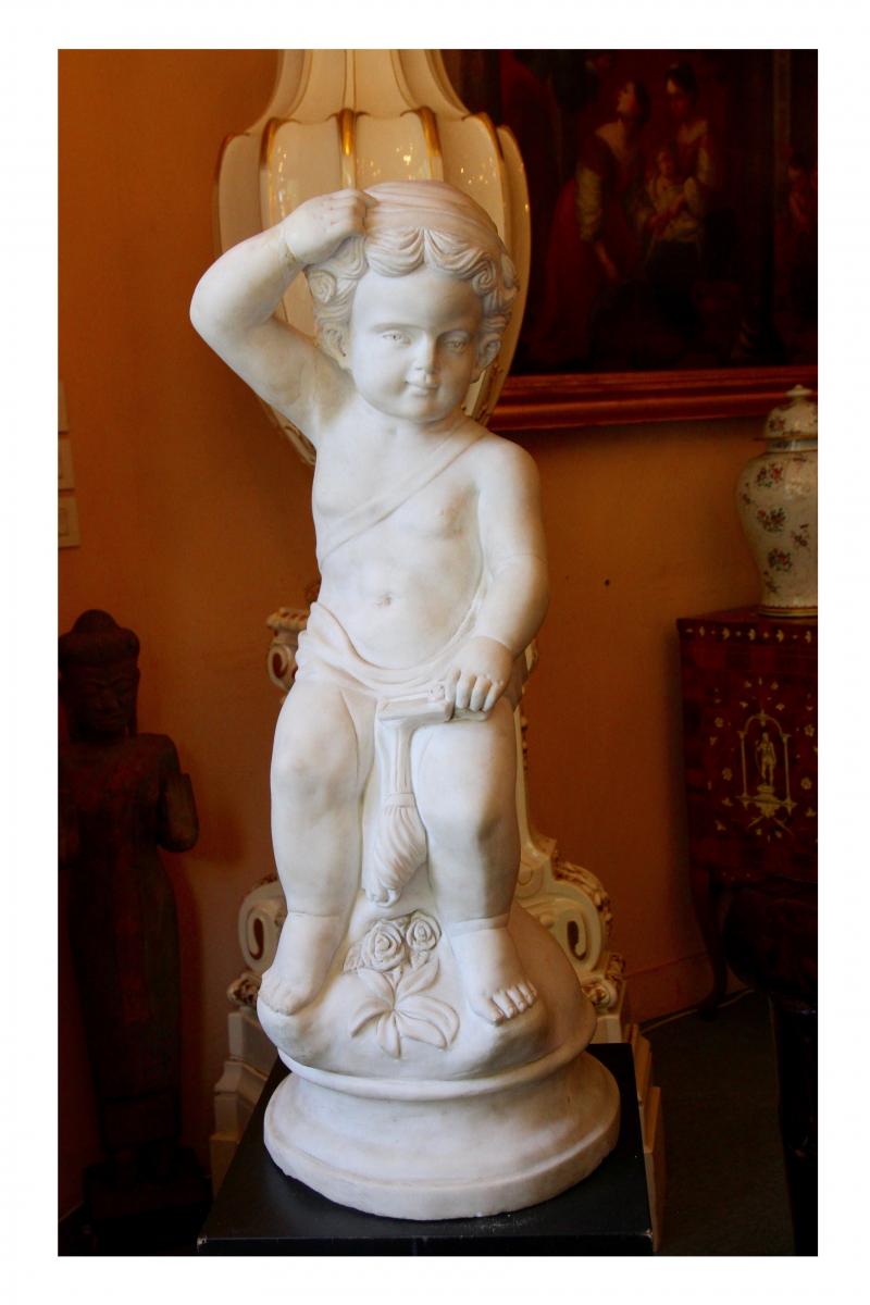 A Carrara Marble Putto, Late Eighteenth / Early Nineteenth Century.