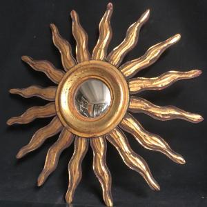 MIROIR SOLEIL SORCIERE 47,5 cm en bois doré  bombé et déformant curiosité sorcière