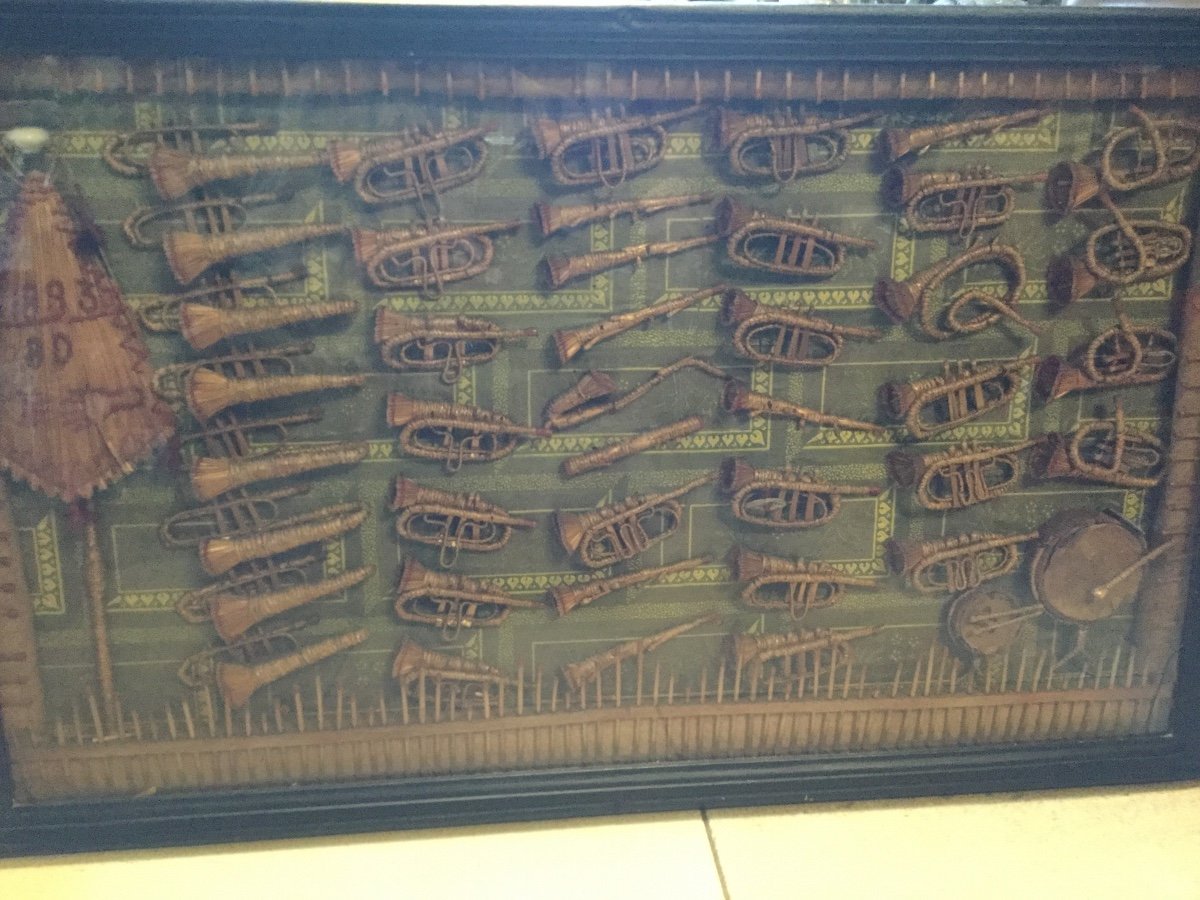 Curiosity . A Frame Containing Various Musical Instruments Made Of Straw And Rattan. Dated 1893-photo-1