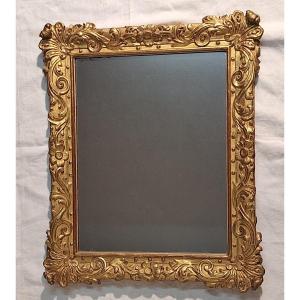 Miroir en bois sculpté et doré , style Régence , XVIIIème 