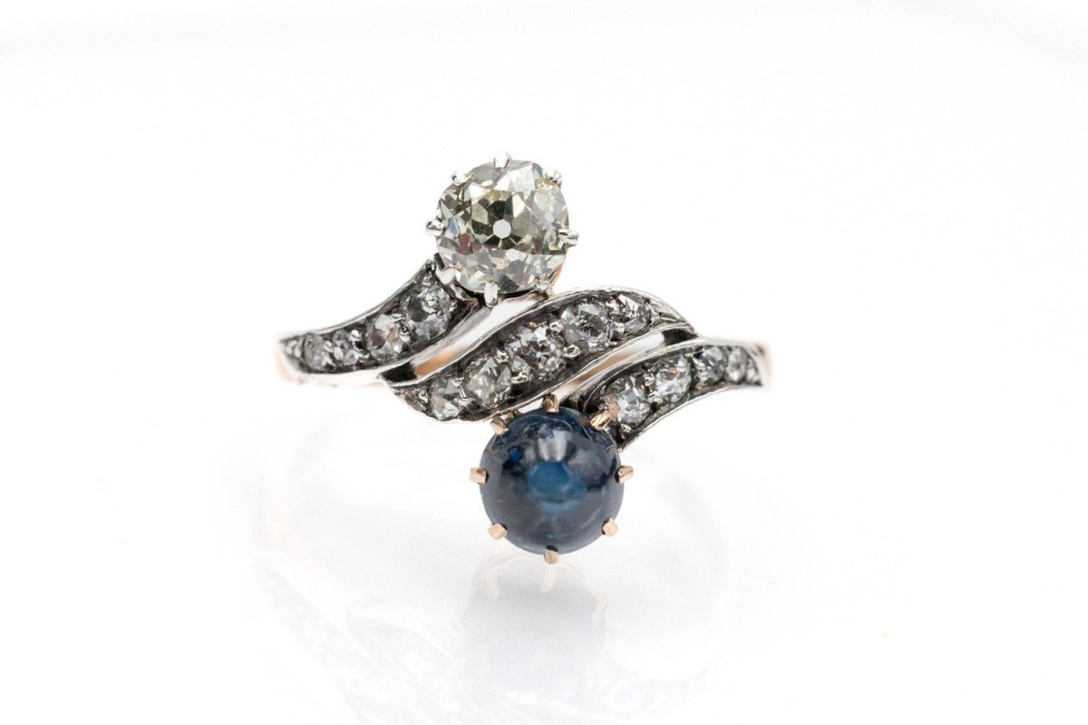 Antique Toi Et Moi Ring With Diamonds And Cabochon Cut Sapphire, Early 20th Century.