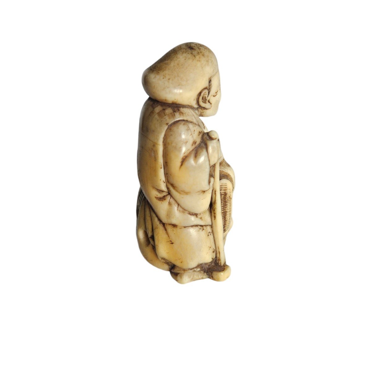 Netsuke Depicting A Traveler Sitting On His Bag-photo-1