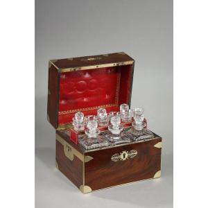 A Liqueur Cellar In Flamed Mahogany Wood With Its Cut Crystal Bottles And Glasses