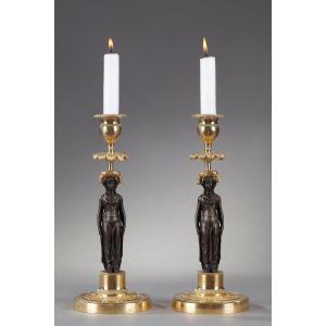 Pair Of Candlesticks In Patinated And Gilded Bronze