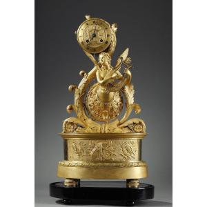 Winged Genius Clock In Gilt Bronze, Charles X Period