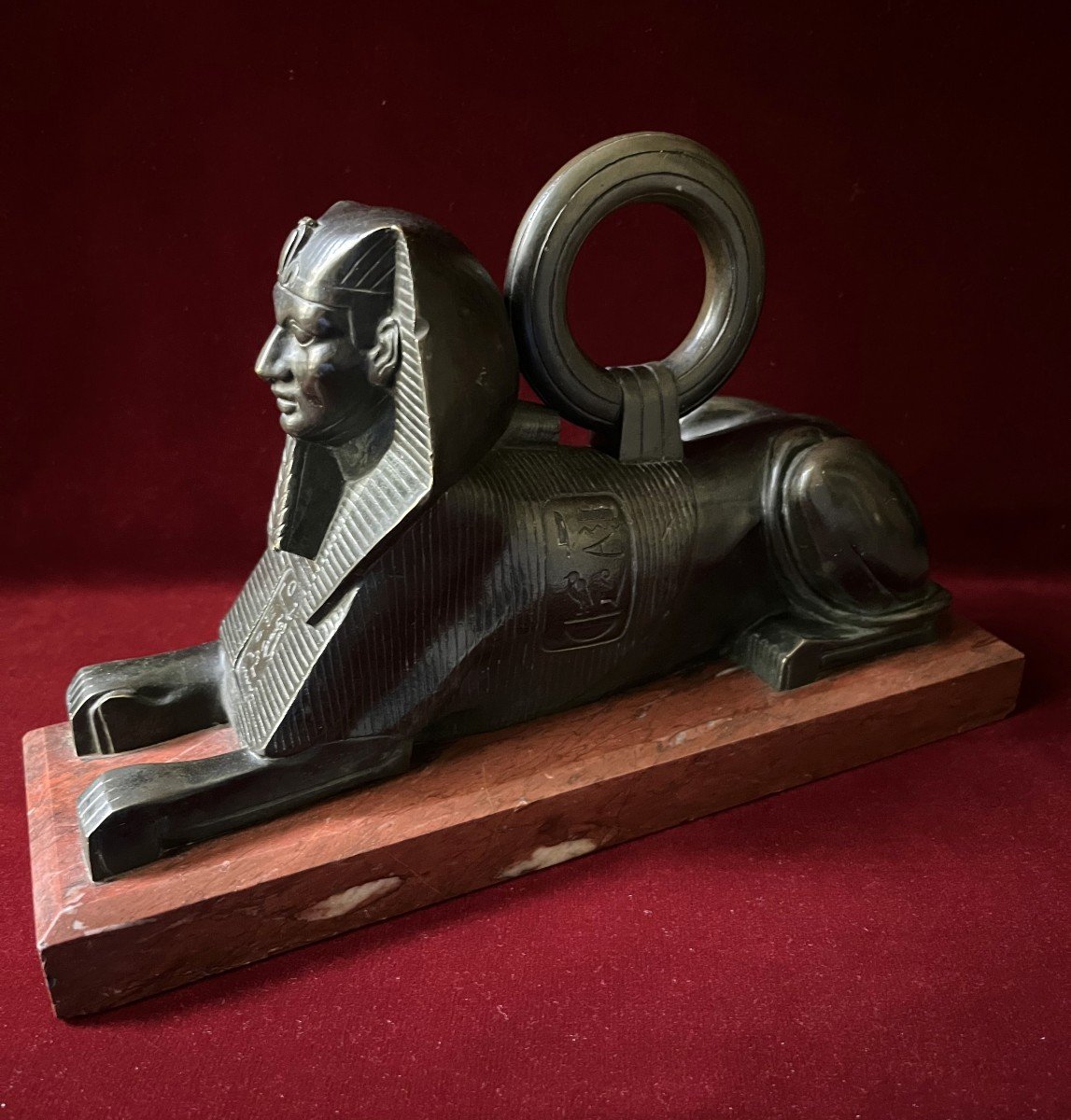 Bronze Sphinx On Red Marble Base