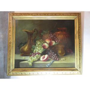 Nature morte aux fruits   , encadrée ,  huile sur toile   début XXème