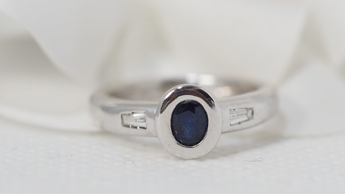 White Gold Ring Set With An Oval Sapphire And Diamonds