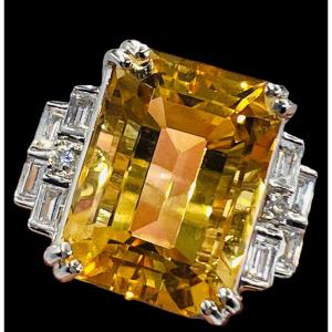 18 Carat Gold Cocktail Ring Set With A Faceted Citrine Surrounded By Calibrated Diamonds