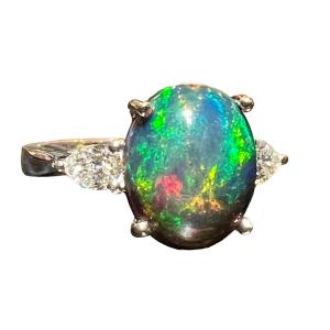 Black Opal Ring Surrounded By 2 Pear Diamonds In 18 Carat White Gold