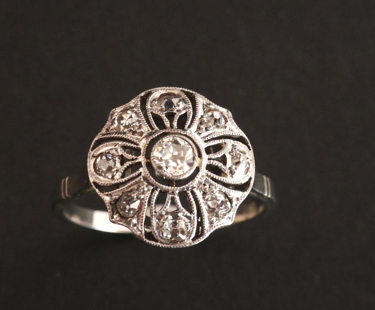 Diamond, Gold And Platinum Flower Ring.