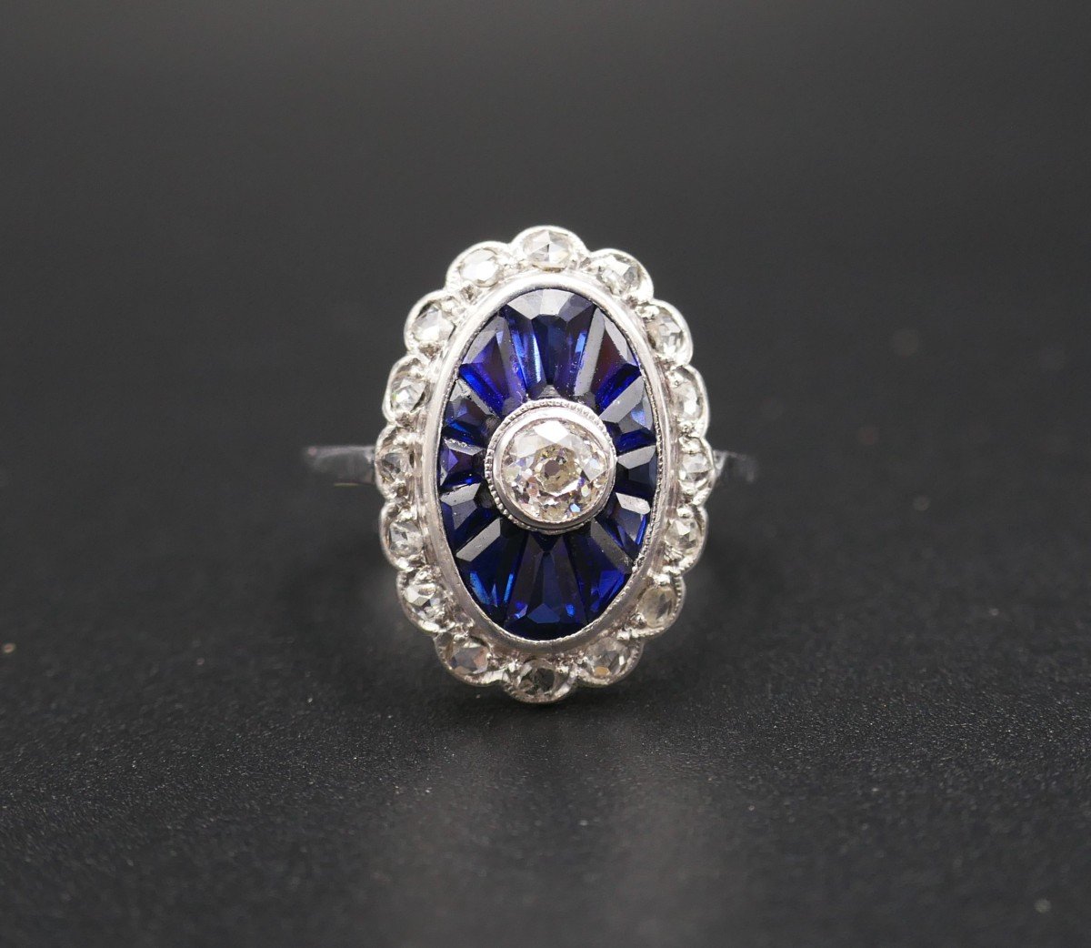 Art Deco Ring With Calibrated Diamonds And Sapphires, 18 Carat Gold.