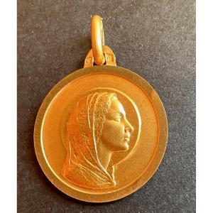 18 Carat Gold Virgin Medal.