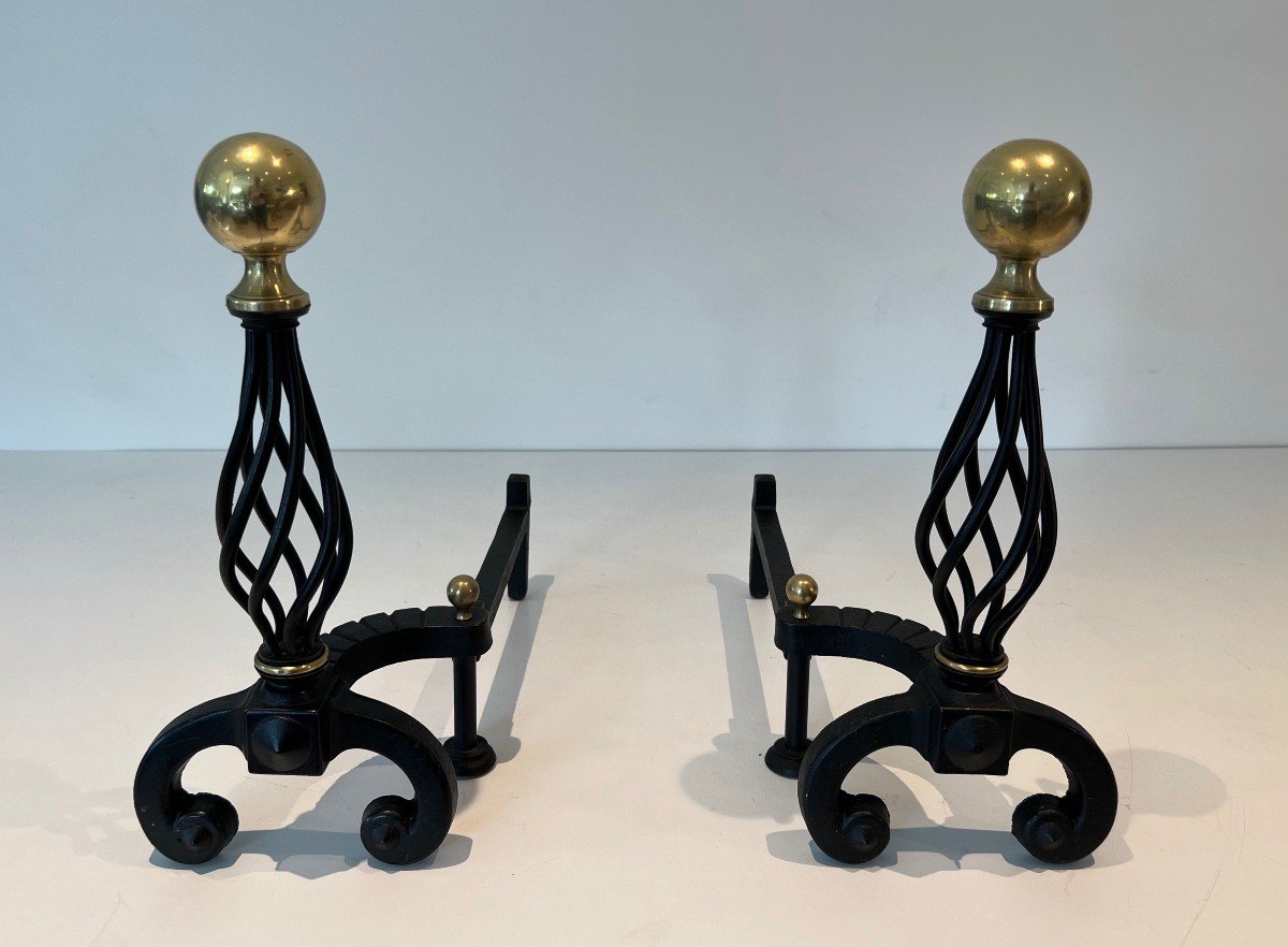 Pair Of Wrought Iron Andirons Topped With A Brass Ball. French Work. Around 1970