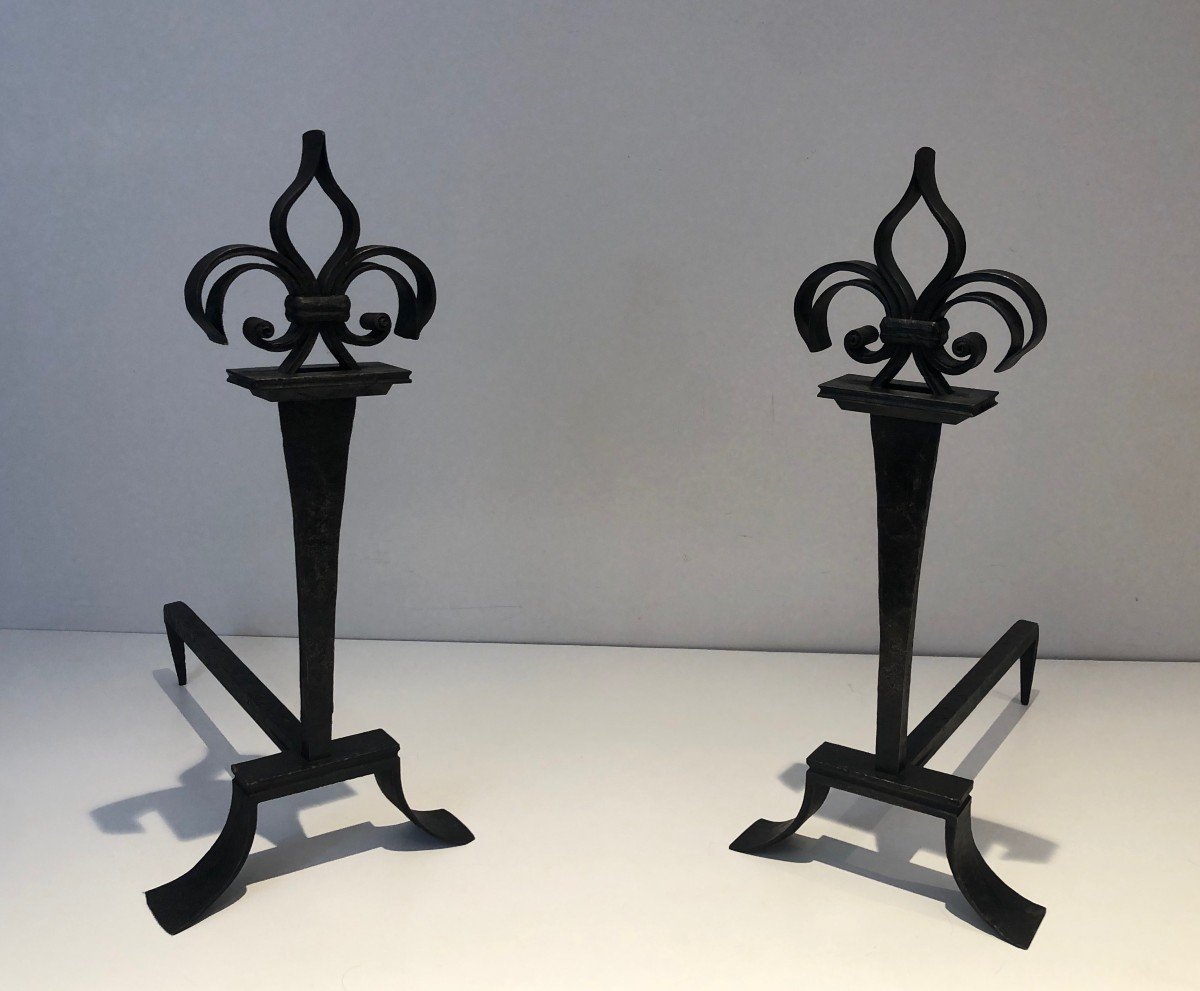 Pair Of Wrought Iron Andirons Topped With Fleurs De Lys. French Work. Around 1950