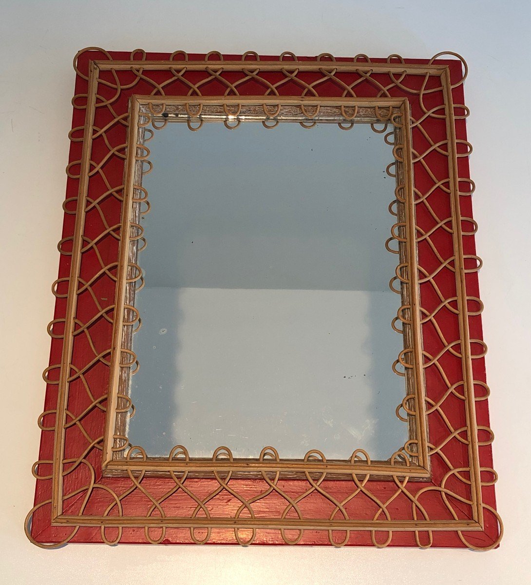 Rattan Mirror On Red Background. French Work. Circa 1940