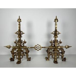 Important Bronze Fireplace Set Composed Of A Pair Of Richly Decorated Bronze Andirons And A Central Bar Connecting The 2 Andirons.