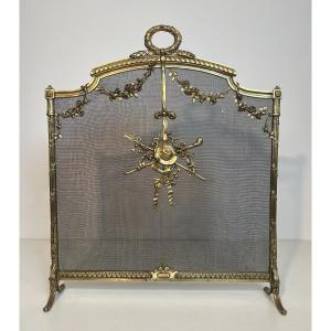 Brass Fireplace Screen With Mesh Decorated With Garlands, Laurel Wreath, Hat And Instruments. 