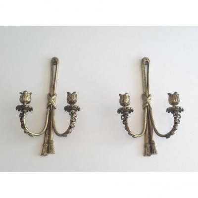 Pair Of Louis XVI Style Wall Sconces In Bronze. Around 1950