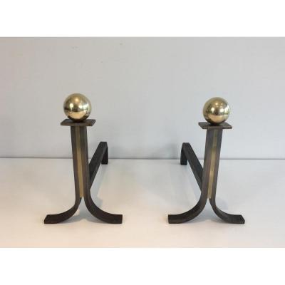 In The Style Of Jacques Adnet. Pair Of Modernist Steel, Iron And Brass Andirons. French. Circa 