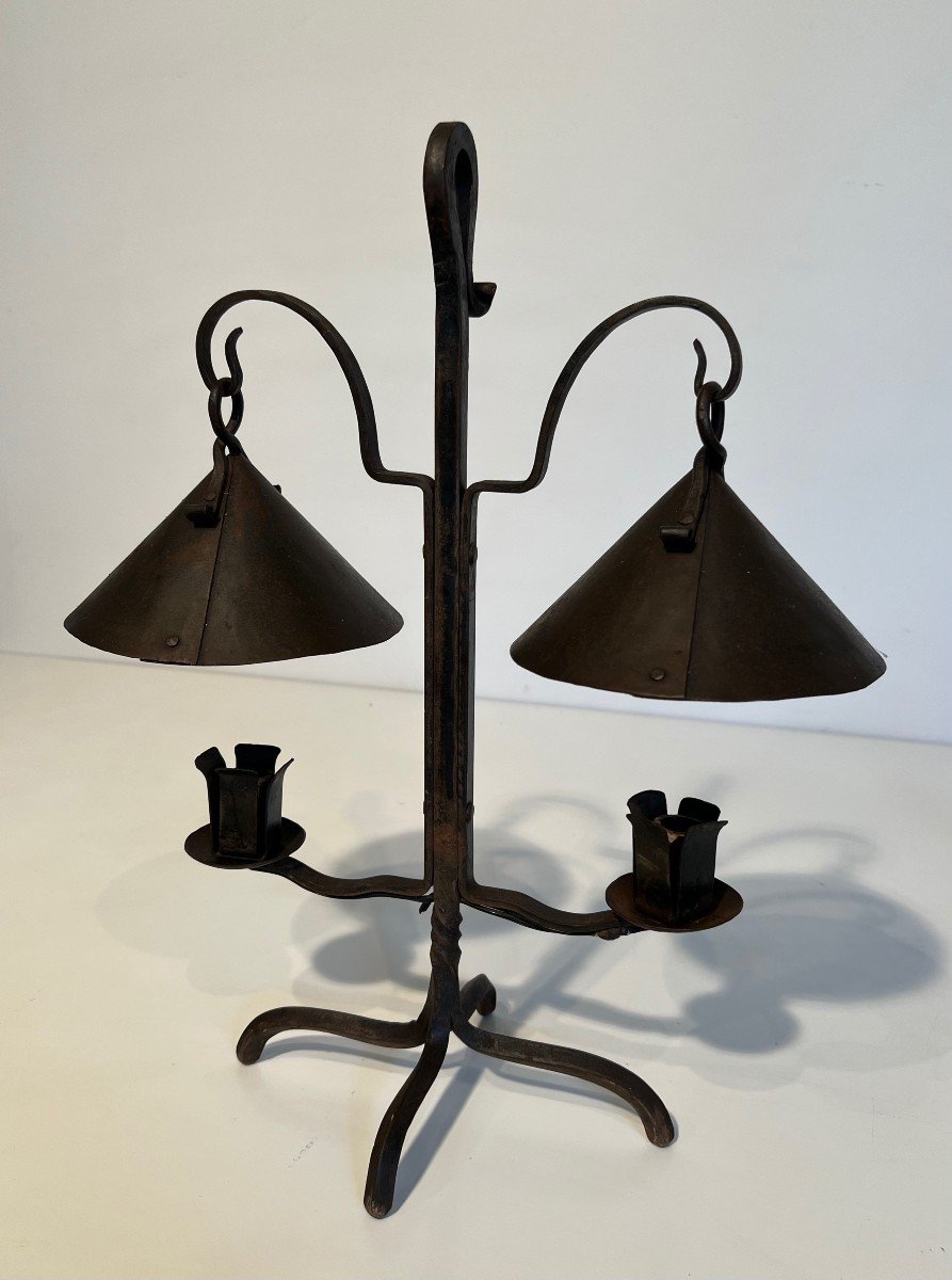 Wrought Iron Candlestick With Two Lights Topped With Riveted Conical Cups. French Work.