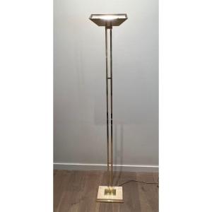 Brass Parquet Floor Lamp With Adjustable Reflector On A Travertine And Brass Base.