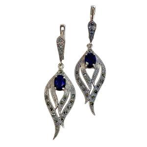 Une Paire De Boucles D’oreilles Flamme