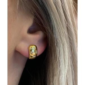 A Pair Of Gold Star Diamond Earrings