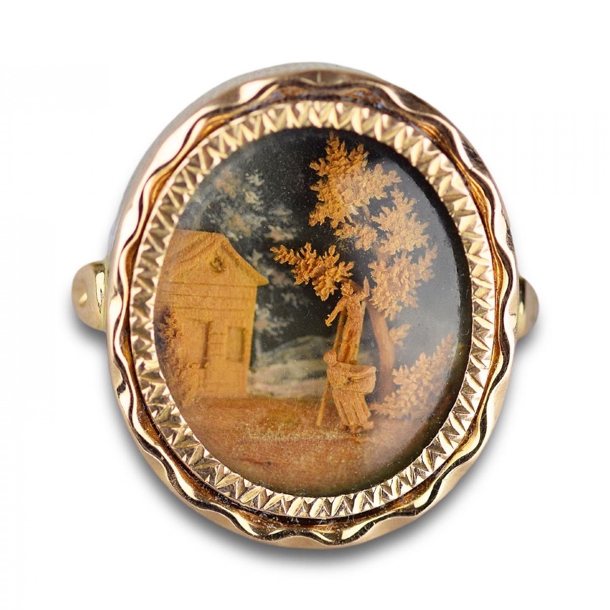 Remarkable Gold Ring Set With A Micro-wood Carving. French, Late 18th Century.