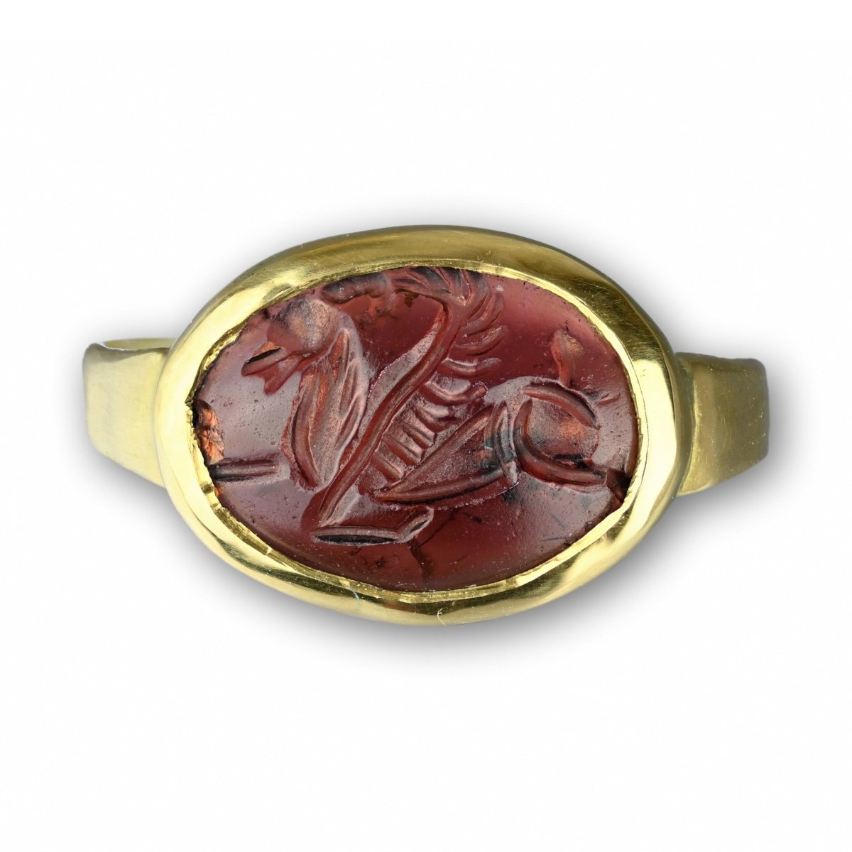 Gold Ring With A Garnet Intaglio Of Pegasus. Sasanian, 3rd - 7th Century Ad.