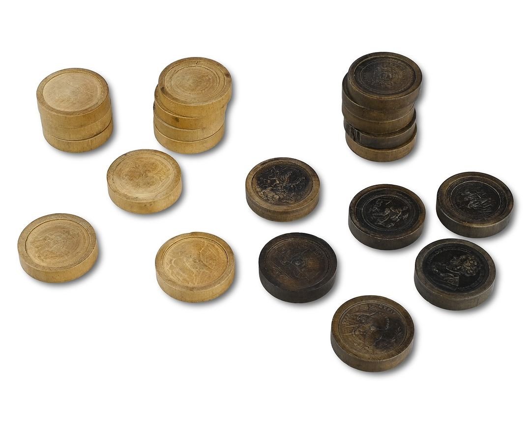 Twenty One Stained And Natural Pear Wood Games Pieces. Nuremberg, 18th Century.