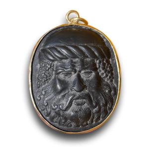 Gold Pendant Set With A Lava Cameo Of Silenus. Italian, Early 19th Century.