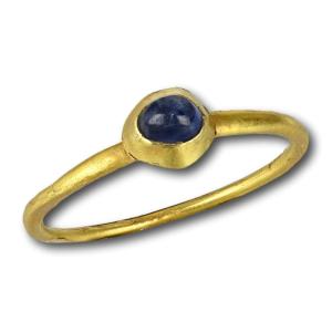Medieval Stirrup Ring Set With A Cabochon Sapphire. English, 13/14th Century.