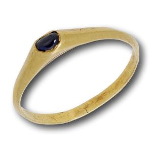 Medieval Gold Sapphire Stirrup Ring. English, Late 13th - Early 14th Century.