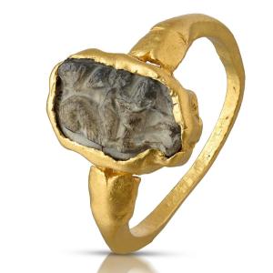 Ancient Gold Ring Set With A Burnt Agate Cameo Of Eros Riding A Hippocampus.