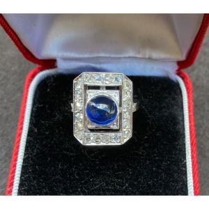 White Gold Ring Set With A Cabochon Sapphire Surrounded By Rose-cut Diamonds 