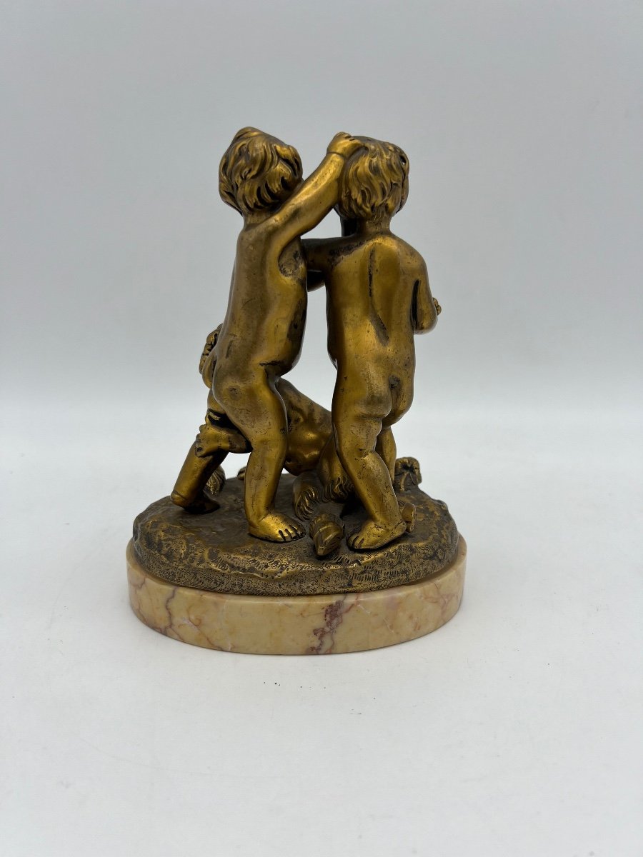 Bronze Statue Of Two Children And A Faun On A Marble Base. -photo-3